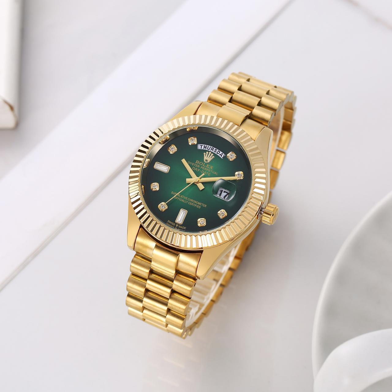 Role_x gold green dial